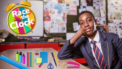 A boy in a school uniform is sitting at a desk. There is stationery next to him. There is a clock icon with text reading 'race the clock'.