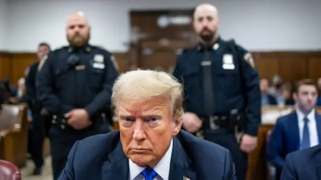 Former US President Donald Trump sits at the defendant's table inside the Manhattan Criminal Court in New York on 30 May 2024