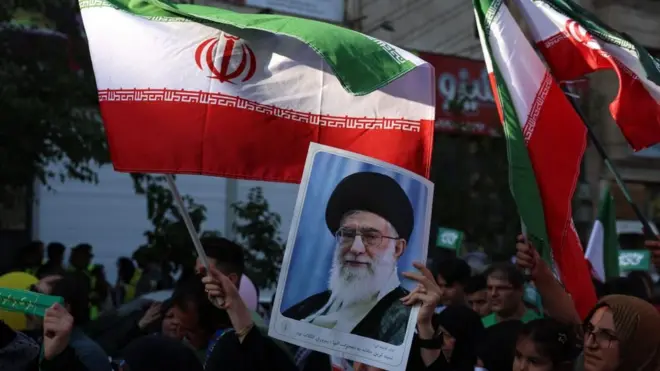An Iranian woman holds a poster of Iranian Supreme Leader Ayatollah Ali Khamenei during an anti-Israel rally in Tehran, Iran, 14 June 2025
