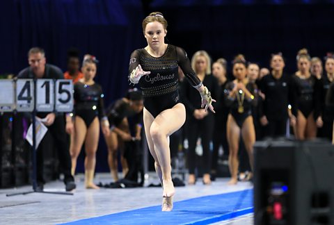 Phoebe Turner, a British gymnast at Iowa State University, runs down the vault track at a competition