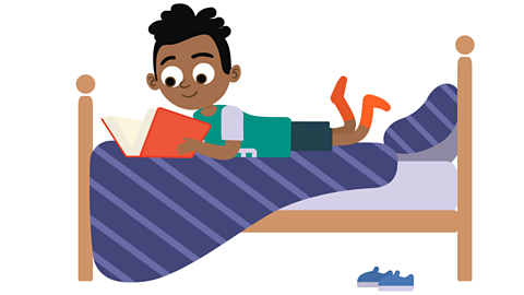a cartoon boy lying on his bed reading a book