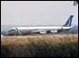 Plane on tarmac with front door open 