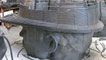 Photos of the miner's head and boots in the studio in various stages of construction
