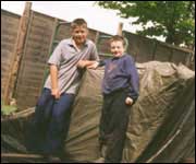 Two boys taking a break in the back garden