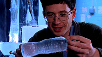 Dr Yan holds a bottle of liquid water.