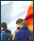 Image of Catholic schoolboys, backdrop Irish flag