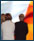 Image of Catholic women from Ardoyne, backdrop Irish flag 
