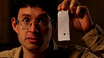 Dr Yan demonstrates the strip of paper you need to cut out from your note. 