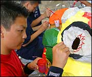 Adding the finishing touches to the dragon's eye