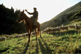 A man on horseback, photo by Tom Ang