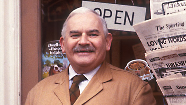 Middle-aged man standing in front of 