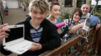The Davies family holding electrical gadgets