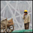 Trabalhador chinês. Foto: AFP