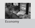Image of men working with computer screens