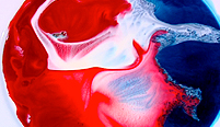 Food dye in milk with liquid soap added.