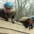 Carrie and Dave climbing over a wall!