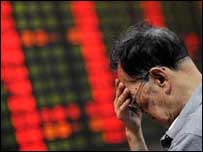 A Chinese investor with his head in his hands