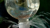 The spray from a shaken lemonade bottle