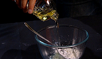 A bowl of cornflour and sunflower oil.