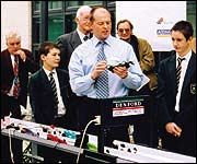 Teacher demonstrating the cars